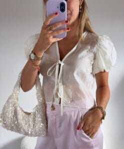Cropped blouse crème met strikjes